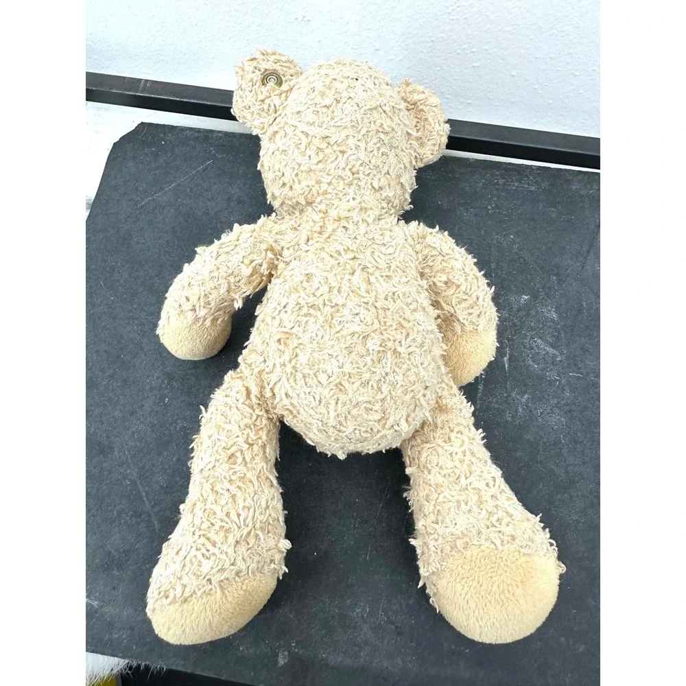 Small Steiff Fynn blonde stuffed teddy bear textured plush